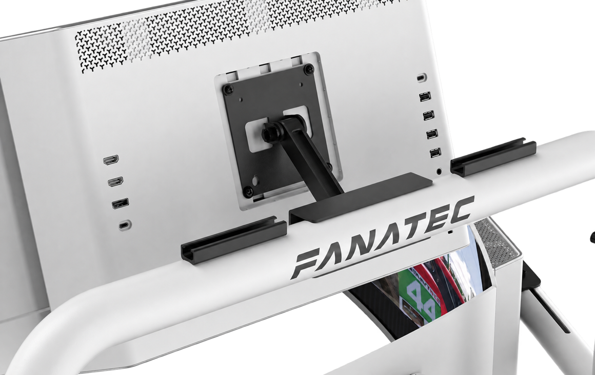 Two T-rail mounts on the black upper tube of a Fanatec stand behind a monitor